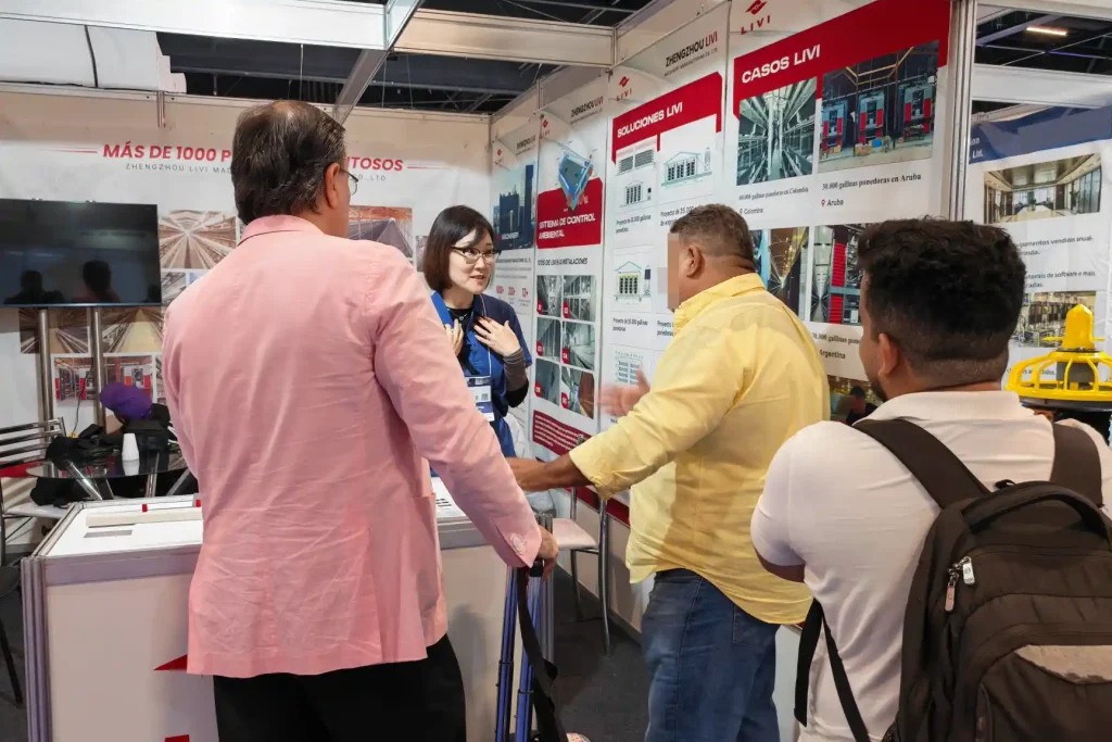 poultry farmers discussing automatic poultry farming solutions with LIVI team at SIAVS 2026